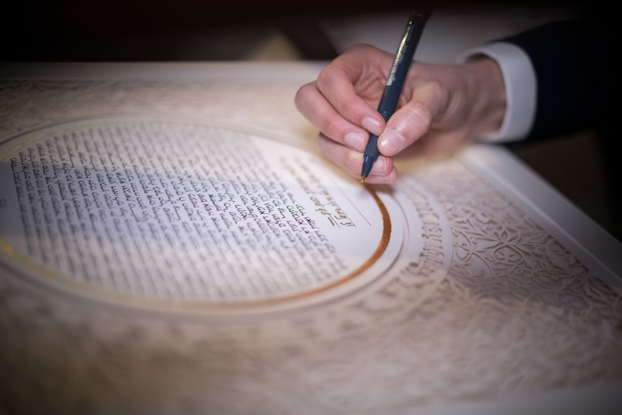 An illustration of a Ketubah illuminated by well-placed lighting